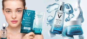 Young woman holding Vichy Minéral 89 skincare products, including booster serum, recovery mask, and 72H moisture cream with water splash background